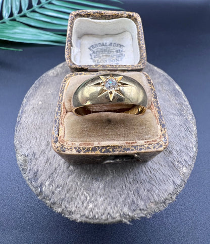 A single stone old cut diamond gypsy band ring in yellow gold, in an antique ring box