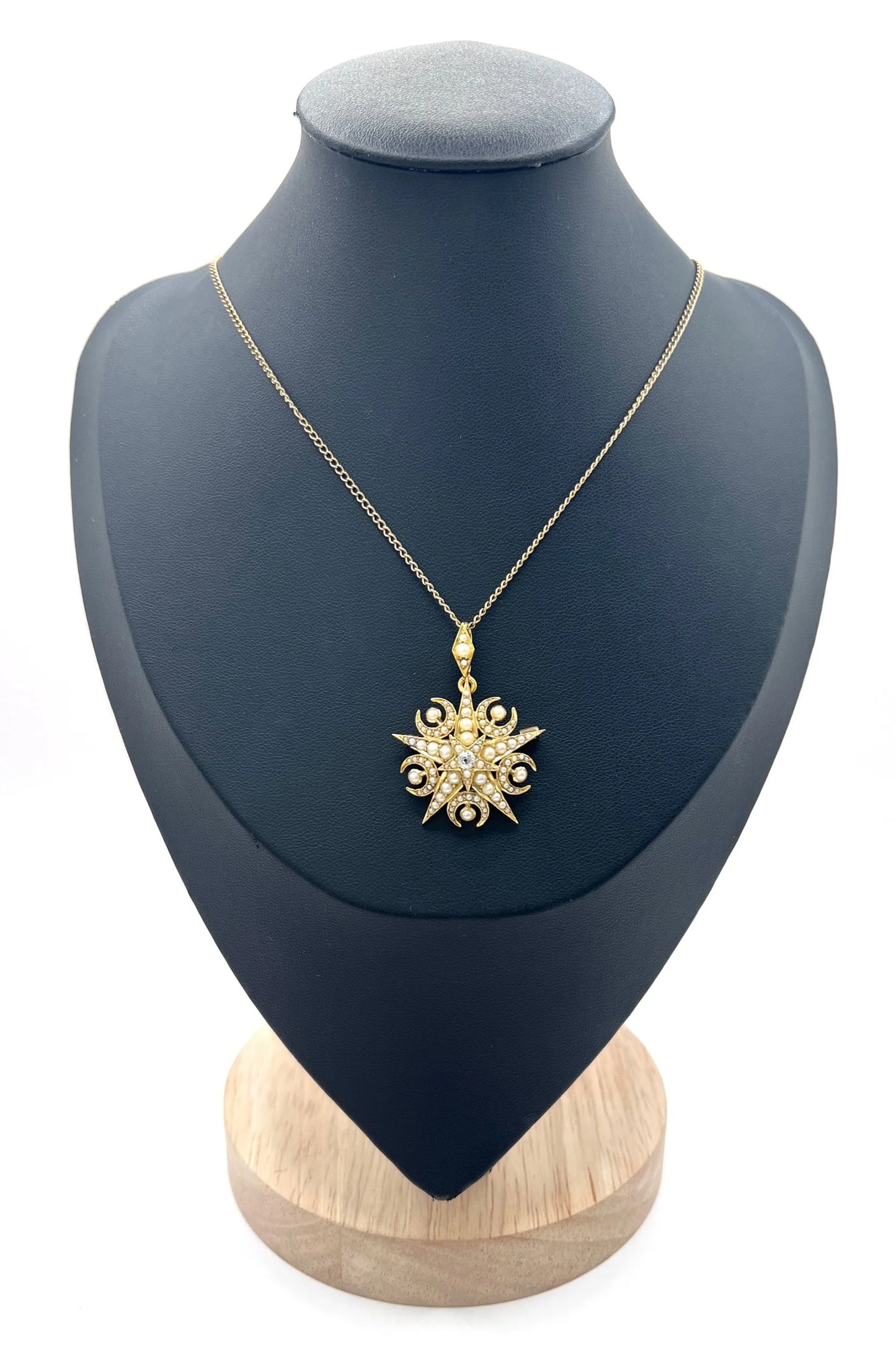 A yellow gold star and crescent brooch/pendant with pearls and a diamond centre, with a chain