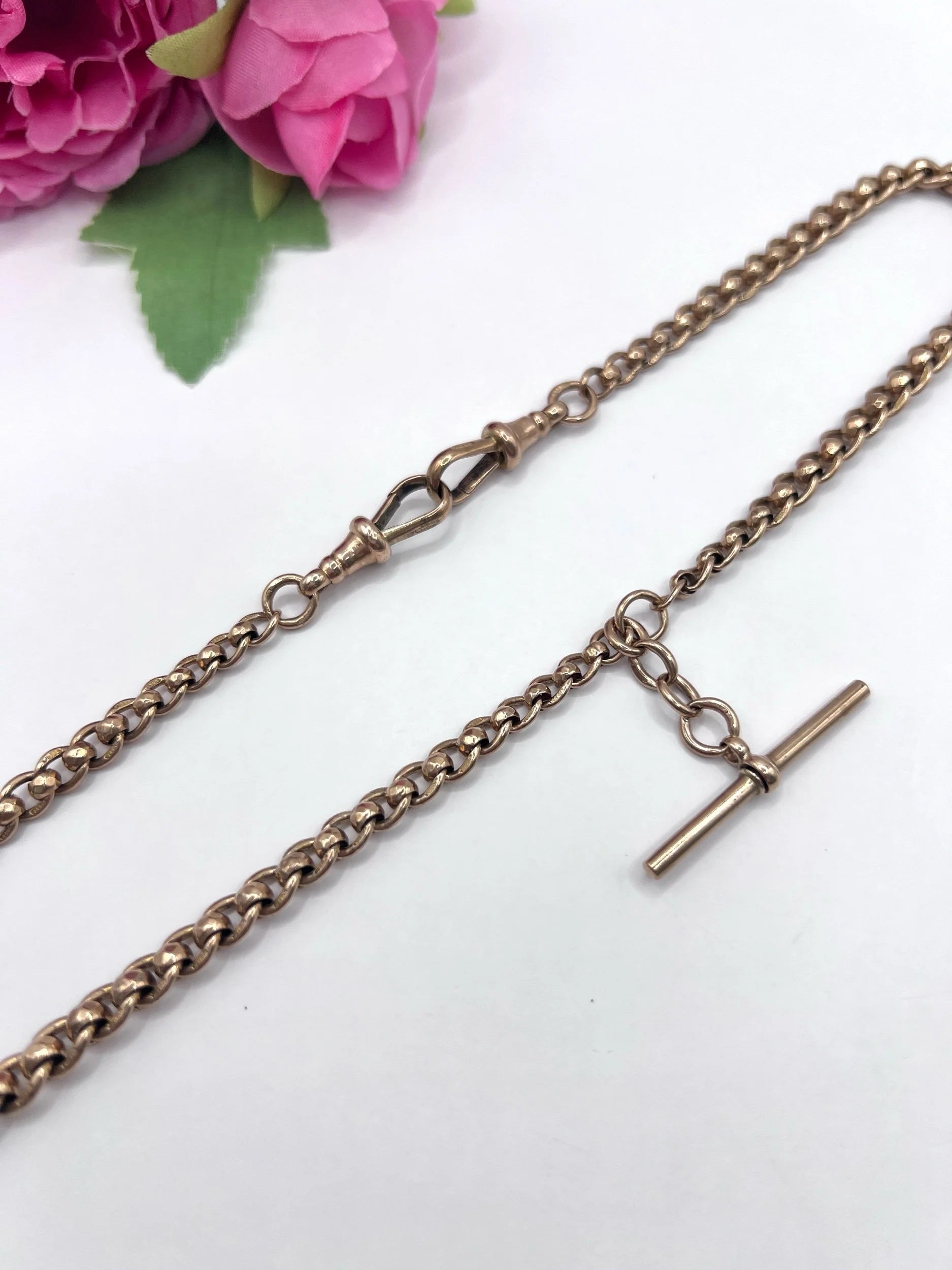 A rose gold fancy link Albert chain necklace with a T-bar attachment