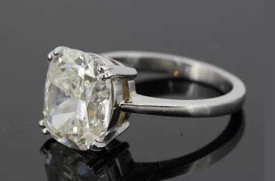 Cushion Cut 5.11 carat Diamond Solitaire Engagement Ring, four double-claw set, mounted in 18ct white gold.