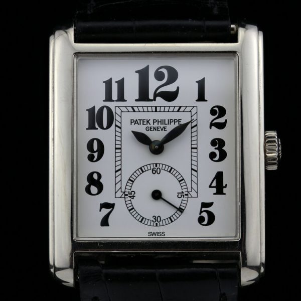 Patek Philippe 18ct White Gold Manual Winding Watch; 29mm 18ct white gold case with white porcelain dial and black Arabic hour markers, on an original Patek Philippe leather strap with an 18ct white gold Patek Philippe buckle, with certificate and Patek Philippe travel pouch