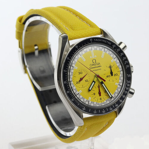 Omega Speedmaster Schumacher Style 39mm Automatic Chronograph, yellow dial, acrylic crystal, on yellow leather strap with Omega steel pin buckle.
