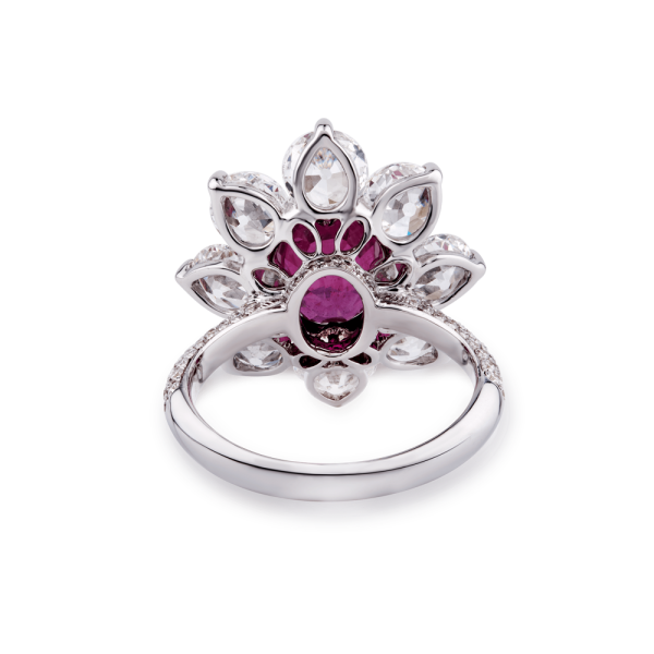 Burmese Ruby and Old Cut Diamond Floral Cluster Ring; central 3.69 carat Burmese ruby framed by 8 round old-cut diamonds, accented by 94 pave set diamonds. Total diamond weight 4.46cts