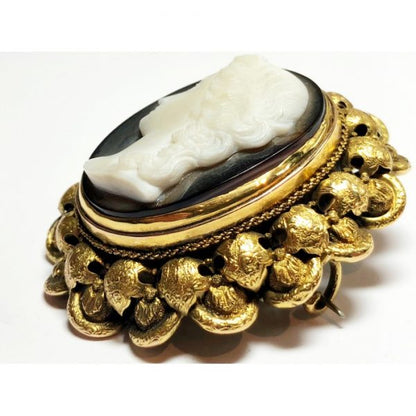 Antique Victorian Cameo Brooch Pendant, sardonyx agate cameo of a lady with Roman hairstyle, in a double row gold frame with a twisted chain and engraved stamped foliate surround, Circa 1875