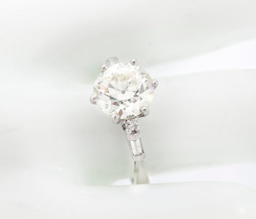 Art Deco Diamond and Platinum Engagement Ring; 3.02ct old European cut diamond with baguette-cut diamond-set shoulders, with GCS certificate