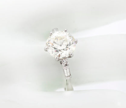 Art Deco Diamond and Platinum Engagement Ring; 3.02ct old European cut diamond with baguette-cut diamond-set shoulders, with GCS certificate