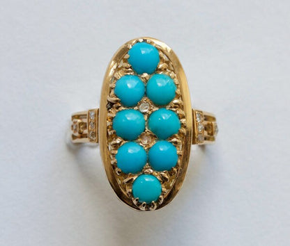 Antique Victorian Cabochon Turquoise, Diamond and Gold Oval Plaque Ring; 18ct yellow gold oval ring set with eight cabochon cut turquoises accented with nine rose cut diamonds. France, 19th century