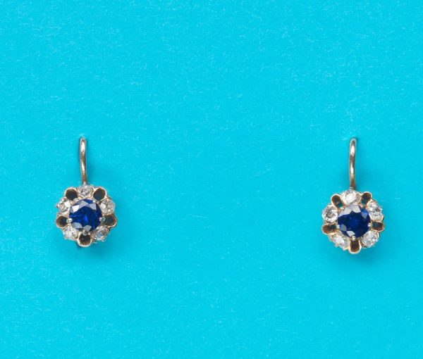 Antique Sapphire and Diamond Flower Cluster Drop Earrings; each with a circular faceted sapphire heart surrounded by five cushion-cut diamonds, 19th century