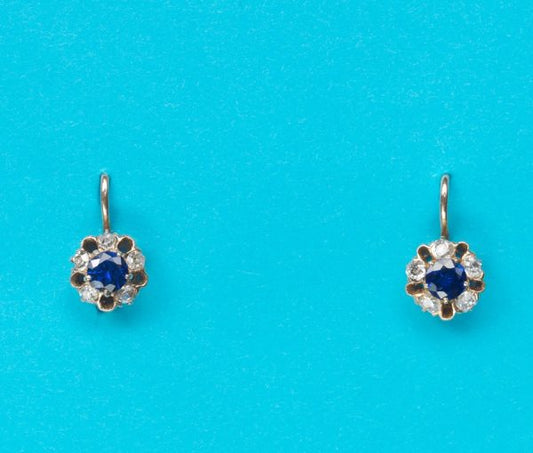 Antique Sapphire and Diamond Flower Cluster Drop Earrings; each with a circular faceted sapphire heart surrounded by five cushion-cut diamonds, 19th century