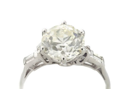 Art Deco Diamond and Platinum Engagement Ring; 3.02ct old European cut diamond with baguette-cut diamond-set shoulders, with GCS certificate