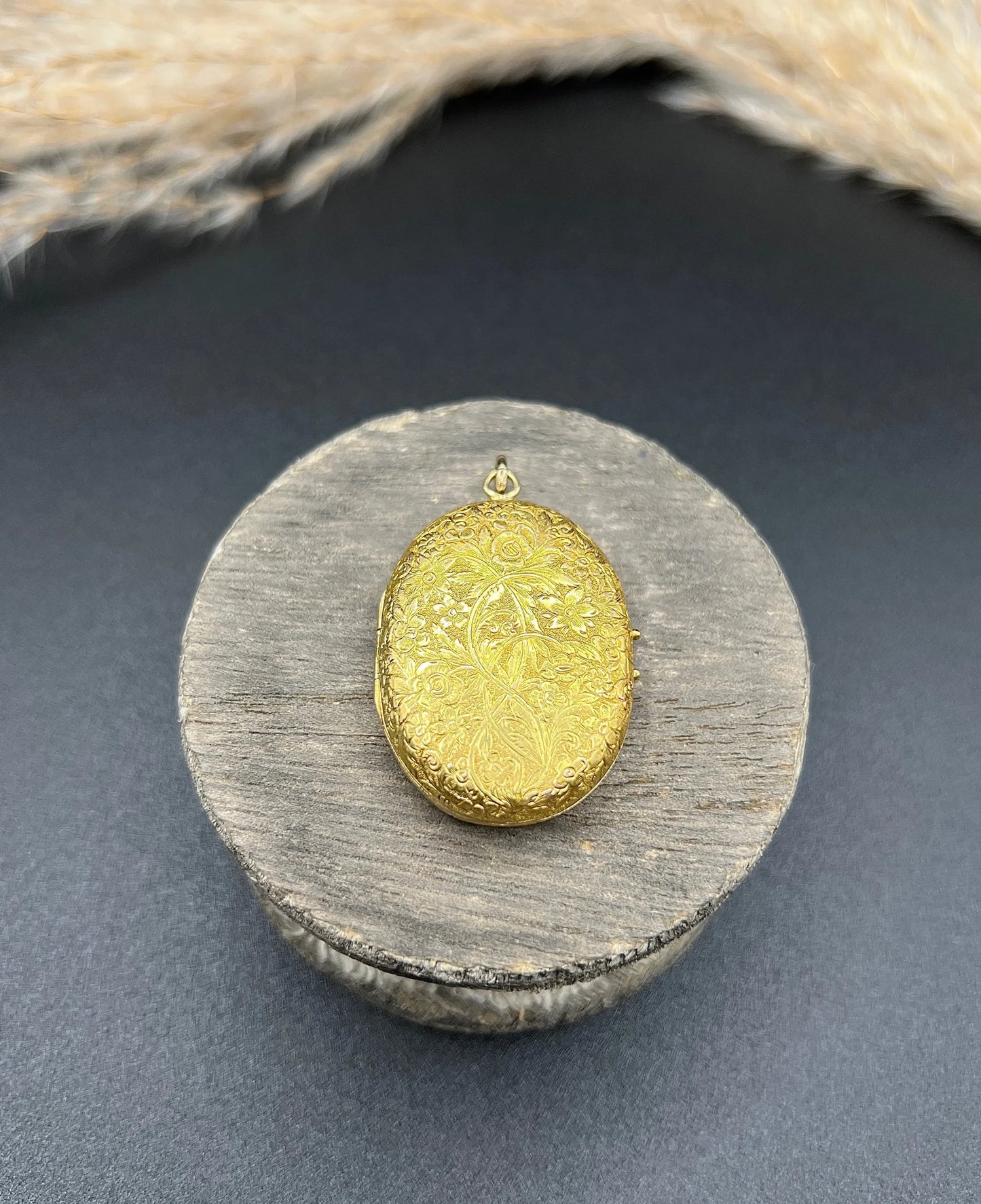 Victorian 18 Carat Yellow Gold Floral Engraved Oval Shaped Locket, Circa 1880