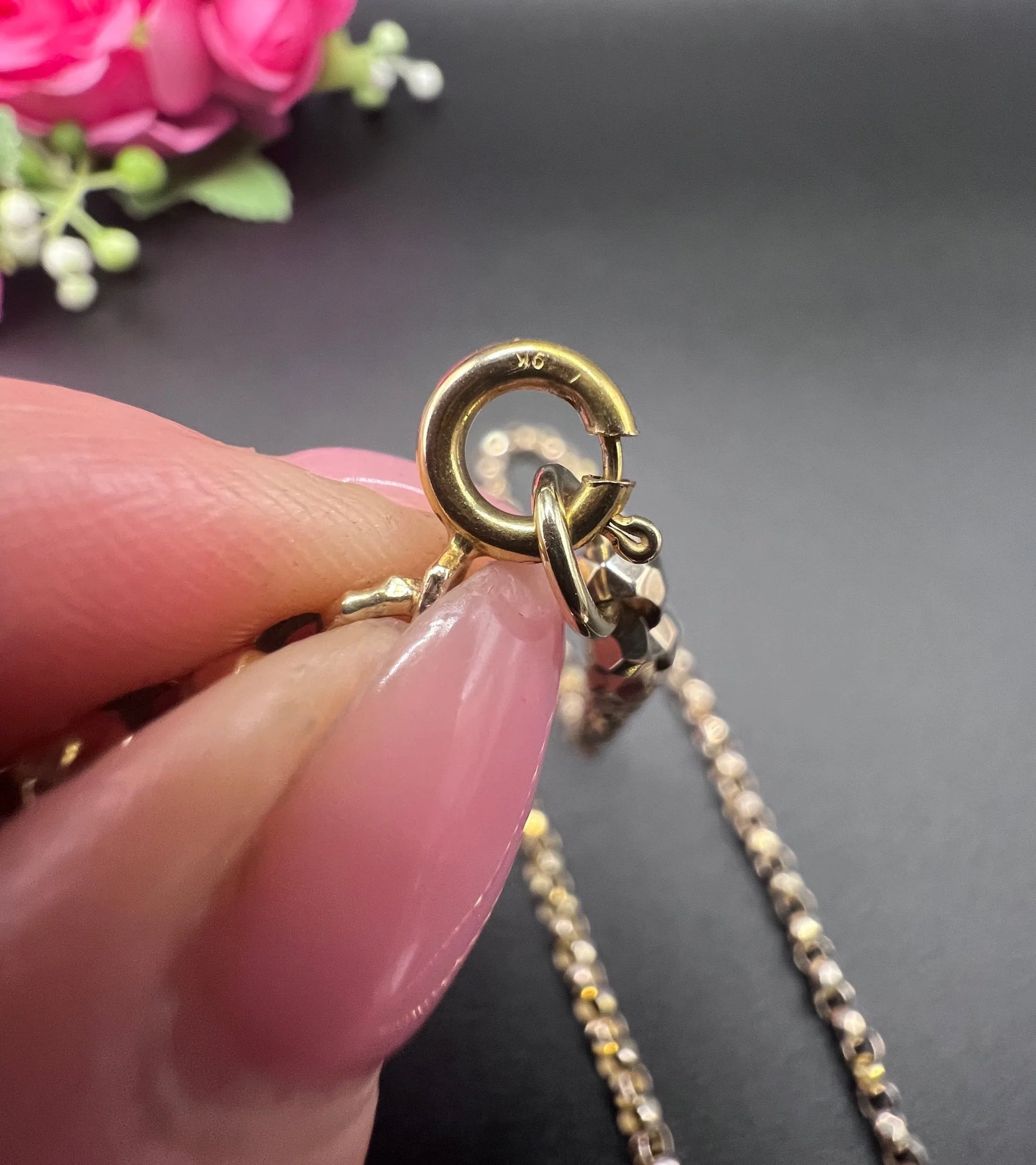 A yellow gold belcher link chain necklace, close-up of the bolt ring clasp
