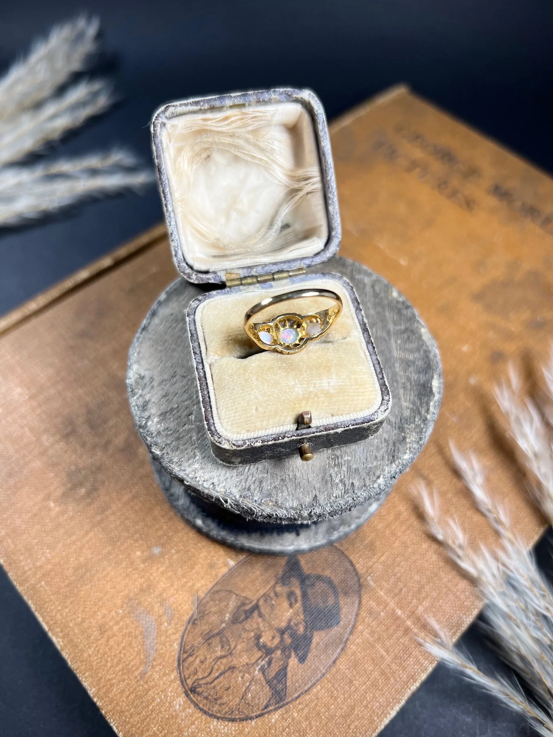 A yellow gold opal and diamond dress ring, in a ring box