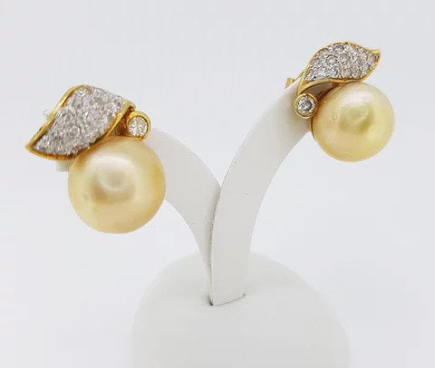 Vintage Golden South Sea Pearl and Diamond Earrings, striking golden South Sea pearls, accented with diamond set leaves, in 18ct yellow gold