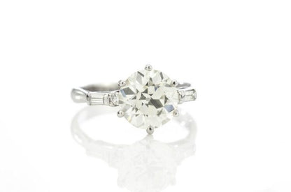 Art Deco Diamond and Platinum Engagement Ring; 3.02ct old European cut diamond with baguette-cut diamond-set shoulders, with GCS certificate