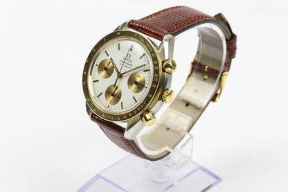 Omega Speedmaster Reduced 39mm Automatic Chronograph in Steel and Gold, white baton dial, yellow gold tachymetre bezel, on red/brown lizard strap with pin buckle.