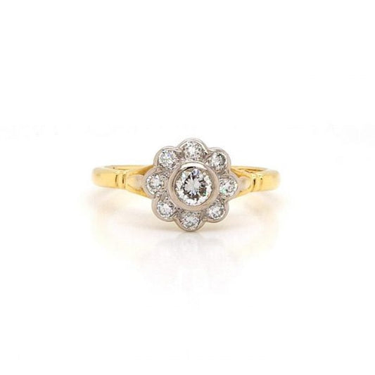 Vintage Diamond Flower Cluster Ring; nine sparkling diamonds collet-set, 0.40 carat total, mounted in 18ct Yellow Gold