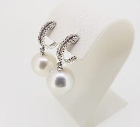 Pearl and Diamond Drop Earrings; featuring 14mm pearls suspended from diamond set hoops, 0.60 carat total, mounted in 18ct white gold.