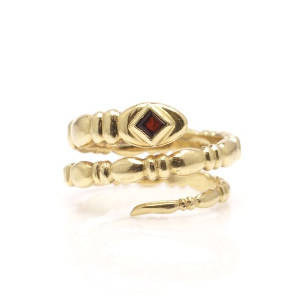 Vintage 18ct Yellow Gold Snake Ring with Garnet; in the form of a snake's body entangling around the wearer's finger, with a square cut garnet to the head, Circa 1989