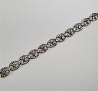 Antique French Old Cut Diamond Bracelet; wonderful fluid design set with 7 carats of old-cut diamonds, in silver-upon 18ct gold. 19th century Circa 1870