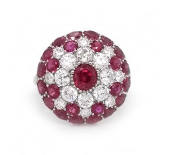 Vintage 1950's Ruby, Diamond and Platinum Bombé Ring; a low domed bombé cluster set with 1.50ct round brilliant-cut diamonds and 2cts round-cut Burma rubies