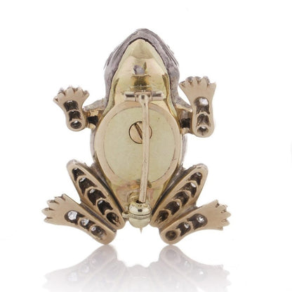 An Edwardian frog brooch in gold and silver set with diamonds and rubies.