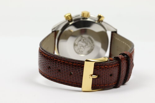 Omega Speedmaster Reduced 39mm Automatic Chronograph in Steel and Gold, white baton dial, yellow gold tachymetre bezel, on red/brown lizard strap with pin buckle.