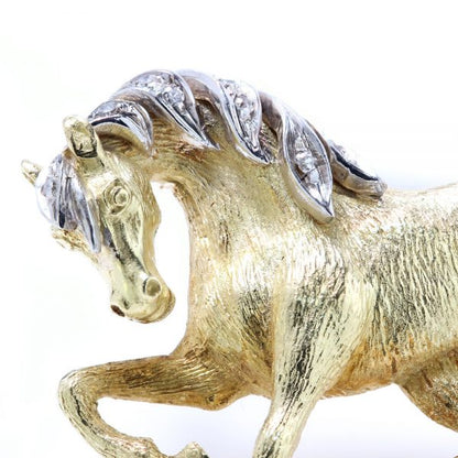 Vintage 18ct Yellow Gold Horse Brooch with Diamonds; with textured detailing to the gold body, accented with diamonds to the mane and tail. Circa 1970s