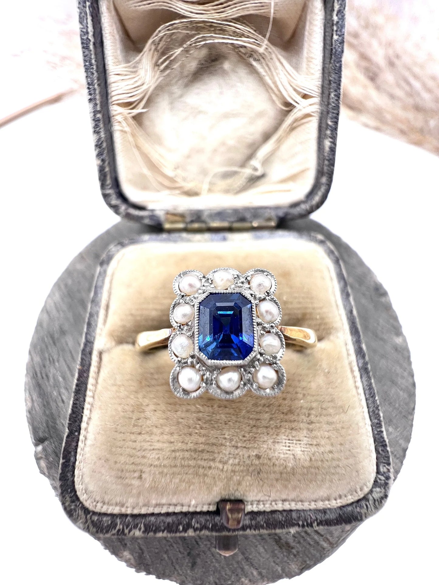 A sapphire and pearl cluster ring in yellow gold and platinum, in an antique ring box