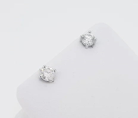 0.91ct Diamond Stud Earrings; round brilliant-cut diamonds, four-claw set, in 18ct white gold. Total diamond weight: 0.91 carats.