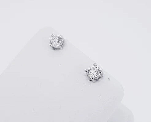 0.91ct Diamond Stud Earrings; round brilliant-cut diamonds, four-claw set, in 18ct white gold. Total diamond weight: 0.91 carats.