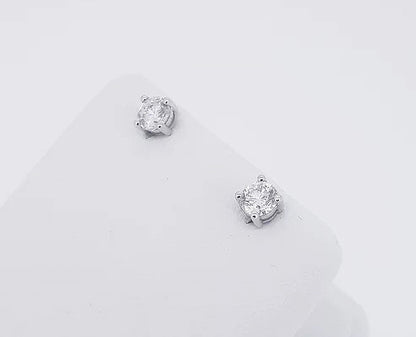 0.91ct Diamond Stud Earrings; round brilliant-cut diamonds, four-claw set, in 18ct white gold. Total diamond weight: 0.91 carats.