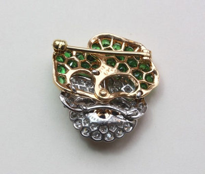 Vintage Tiffany and Co Diamond, Tsavorite Garnet and Sapphire Pansy Flower Brooch; set with 1.10ct tsavorite garnets and 2.10cts brilliant diamonds, Signed