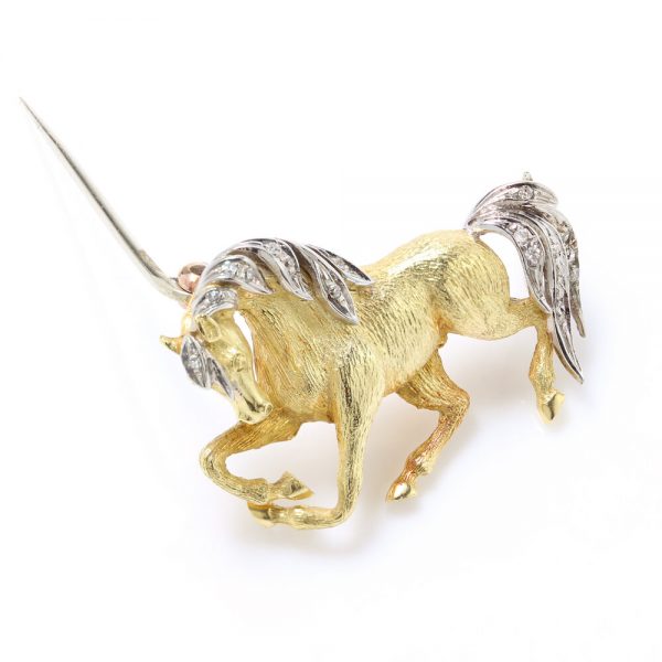 Vintage 18ct Yellow Gold Horse Brooch with Diamonds; with textured detailing to the gold body, accented with diamonds to the mane and tail. Circa 1970s