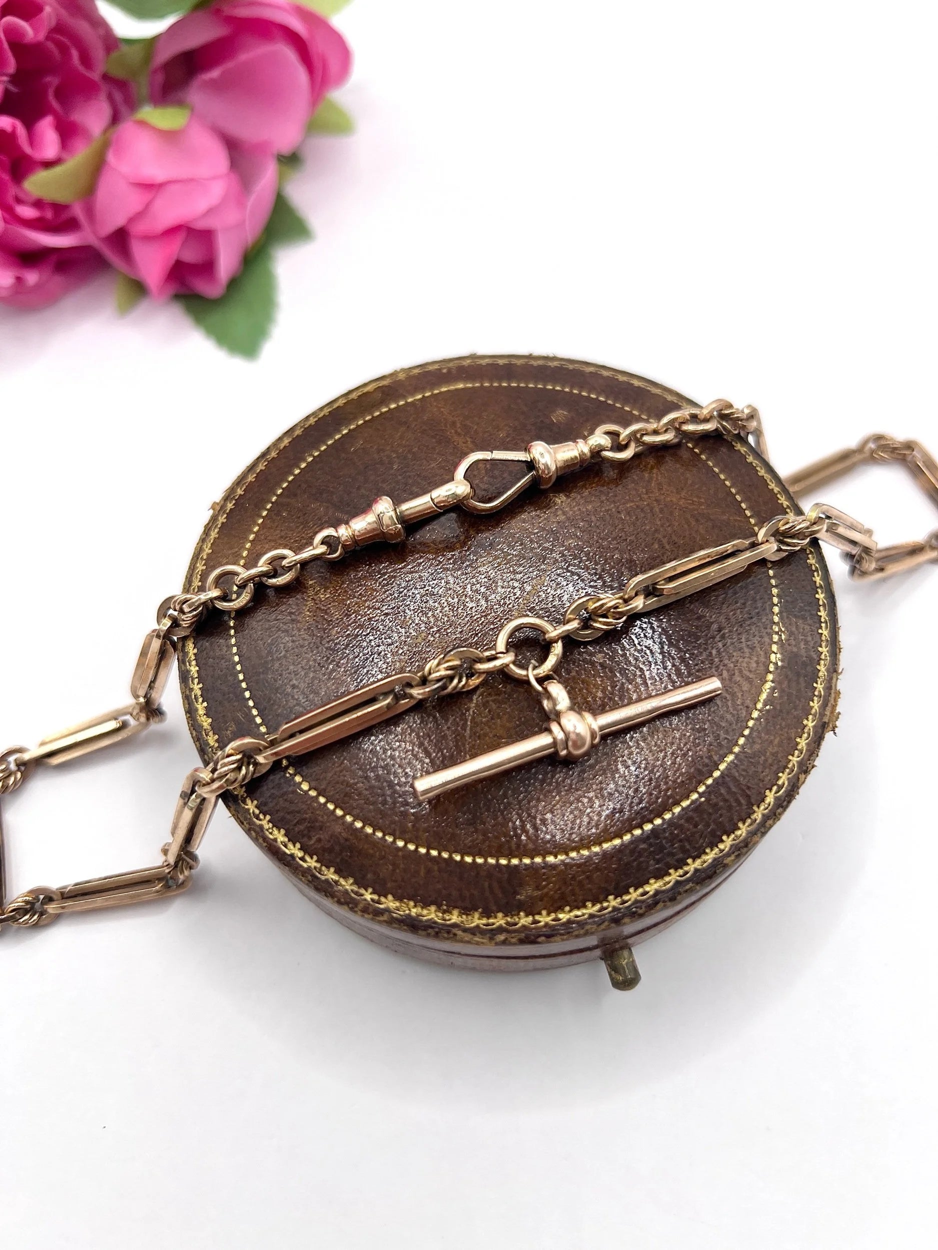 A rose gold fancy link Albert chain necklace