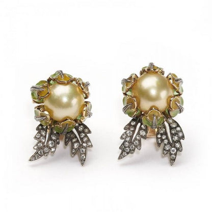 Yellow South Sea Pearl, Enamel and Diamond Flower Earrings; yellow South Sea pearl centres with yellow to green plique à jour enamel petals and eight-cut and old-cut diamond set leaves