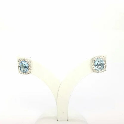Aquamarine and Diamond Cushion Shaped Stud Earrings; 1.53 carats cushion cut aquamarines surrounded by 0.38cts sparkling diamonds, in 9ct white gold