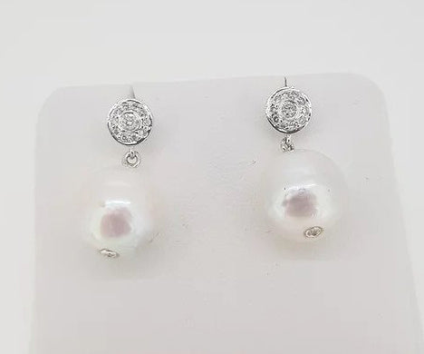 South Sea Pearl and Diamond Drop Earrings; featuring South Sea pearls suspended from a diamond set cluster stud, 0.28 carats, 18ct white gold