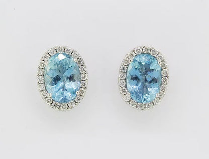 Aquamarine and Diamond Oval Cluster Stud Earrings; oval aquamarines surrounded by sparkling brilliant-cut diamonds, set in 18ct white gold