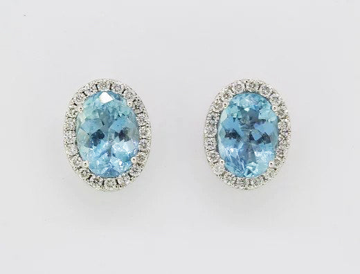 Aquamarine and Diamond Oval Cluster Stud Earrings; oval aquamarines surrounded by sparkling brilliant-cut diamonds, set in 18ct white gold