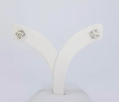 Classic pair of diamond stud earrings; featuring round brilliant-cut diamonds, 0.50 carat total, four-claw set, in 18ct white gold.