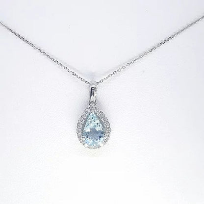 Aquamarine and Diamond Pear Shaped Cluster Pendant; 1.13ct pear cut aquamarine surrounded by 0.21cts brilliant cut diamonds, in 9ct white gold