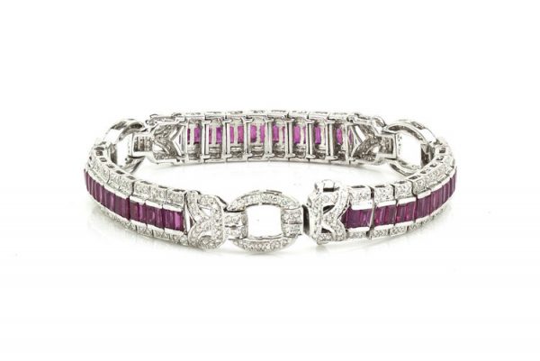 Vintage Ruby and Diamond Bracelet, 2.40cts baguette-cut rubies surrounded by 2.71cts diamonds, diamond set circular links, Circa 1990's.