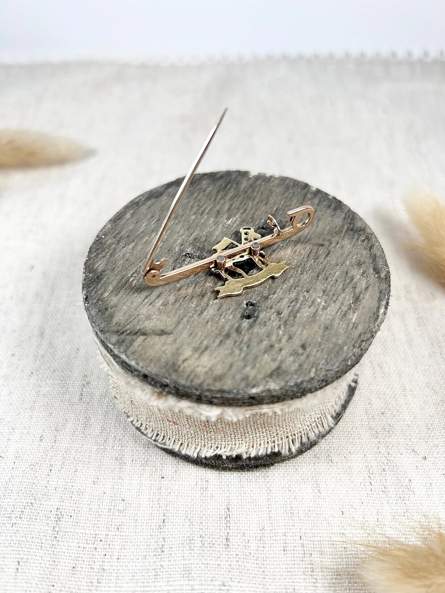 A diamond set regimental bar brooch in gold