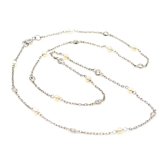 A pearl and diamond chain necklace in platinum