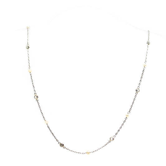 A pearl and diamond chain necklace in platinum
