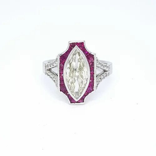 Art Deco Style Marquise Diamond and Ruby Plaque Ring; 1.60ct marquise-cut diamond surrounded by calibre cut rubies, diamond set split shoulders, in 18ct white gold, with certificate