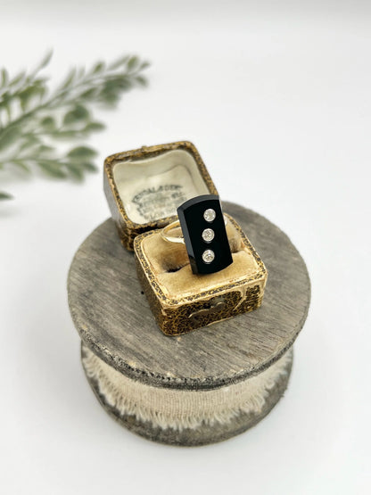 Art Deco 18 Carat Gold Rectangular Onyx and Diamond Three Stone Ring, Circa 1920