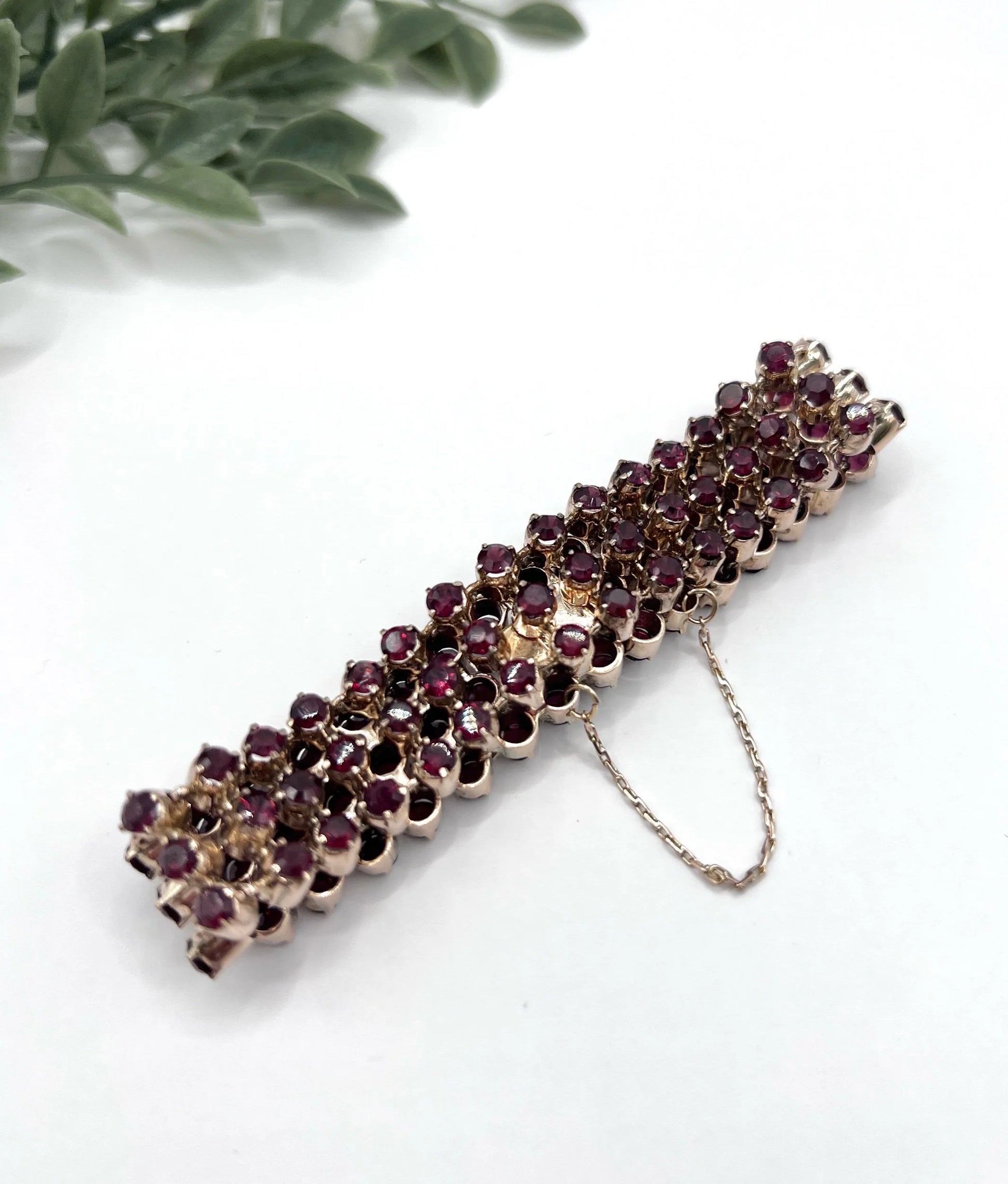 A triple row garnet bracelet in rose gold