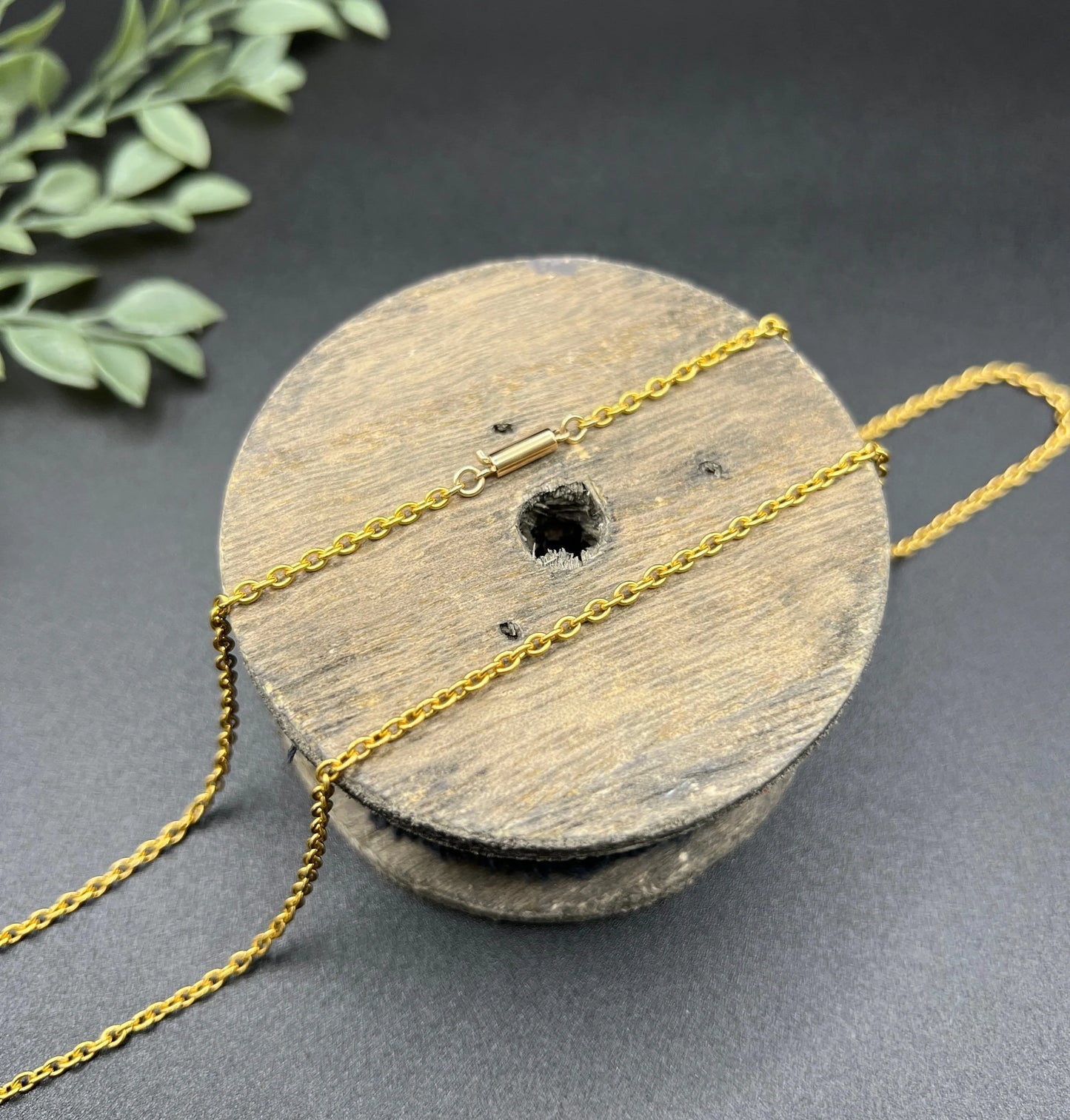 A yellow gold trace link chain necklace